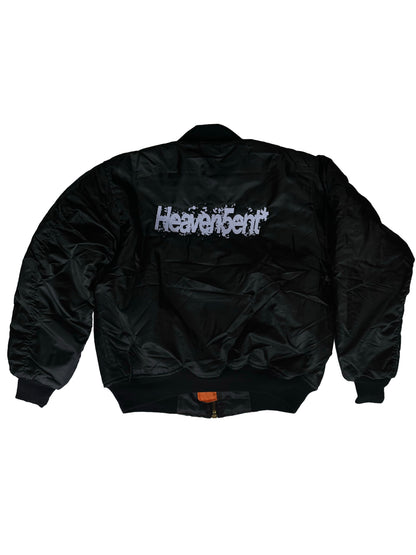 Black jacket with 'Heaven sent' branding on a white background with embroidering in front and back